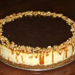 SnickersCheesecake Isn't this beautiful? I'll give you a hint. MINE LOOKS NOTHING LIKE THIS. Mine is much more of a hot mess.