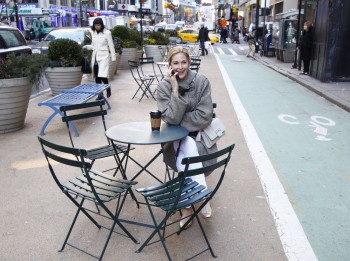 Kelly Rutherford Evening Clutch having coffee