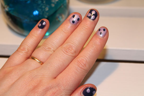 Nail art dots made with nail polish applicator brush.