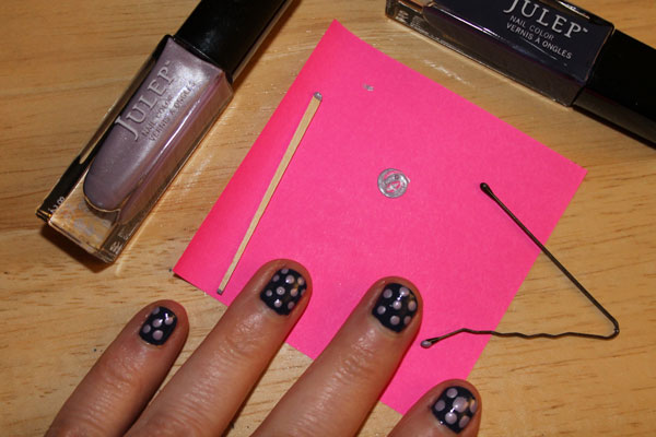 Creating nail art dots with a tooth pick and a bobby pin.